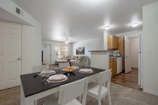 Set Kitchen Table With Kitchen And Living Space In The Background